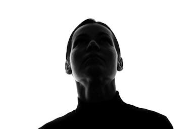 Portrait of a young woman looking up, front view - horizontal silhouette