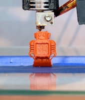 Automatic three dimensional 3d printer performs product creation. Modern 3D printing or additive man...