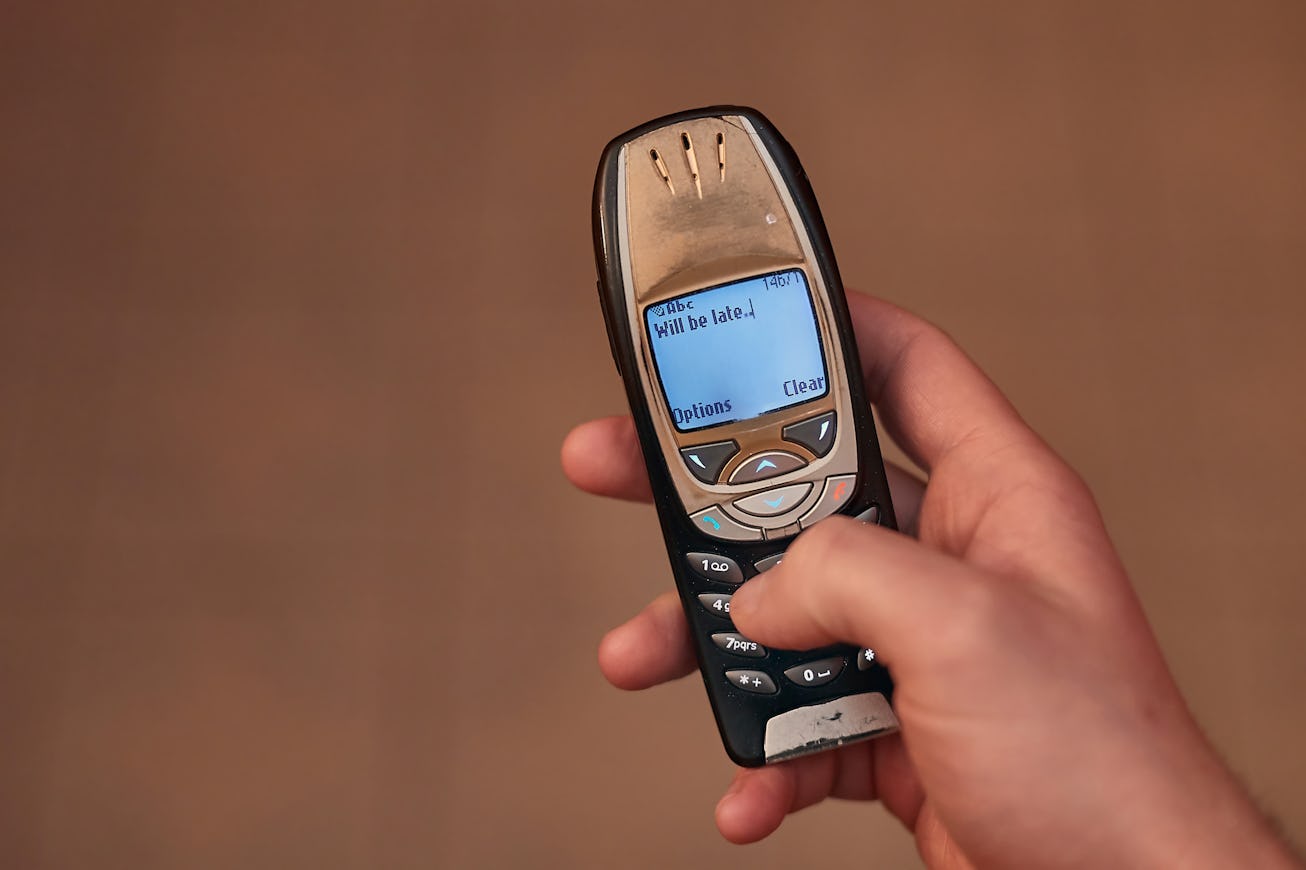 Texting on an old cellphone with monochrome screen