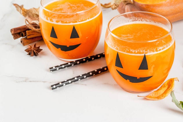 Ideas for a children's party and Halloween treats.  Pumpkin orange cocktail in glasses, decorated ...
