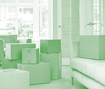 Cardboard carton boxes stack with household belongings in modern house living room. Packed container...