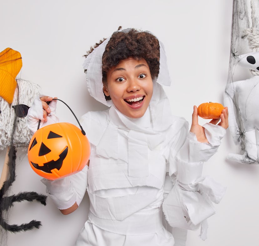 A woman is dressed up for Halloween and is all wrapped up, which would make a great caption for mumm...