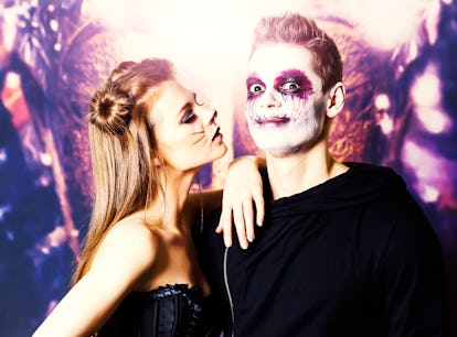 couple dresses up as a cat and a zombie for Halloween, which is a great cheap costume that you can y...