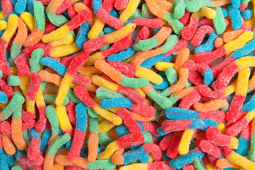 A closeup of a tangle of brightly colored sour gummy worms, which were one reader's first pregnancy ...