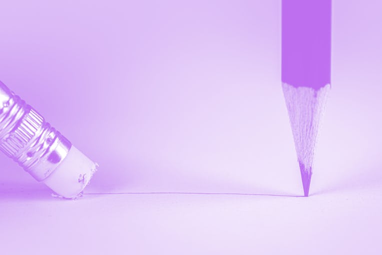 Closeup pencil eraser or delete on paper for removing a written mistake.Examination for fix and corr...