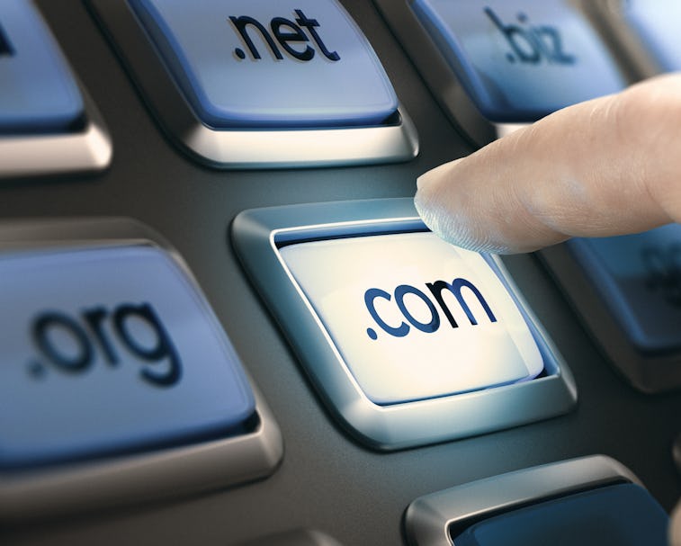 Finger pushing a button on a conceptual dashboard with domain extensions. Composite image between a ...