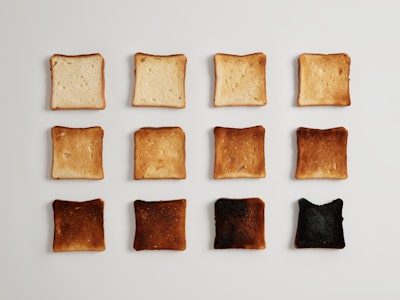 Pieces of bread browned as result of toasting. Delicious crust tender slices of bread prepared in to...