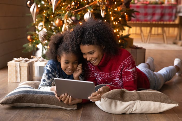 mother and daughter laughing together at christmas