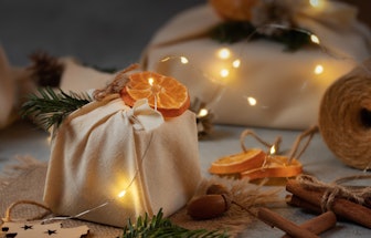 Zero waste christmas concept. Packed in natural fabric gifts and decorations from natural materials ...