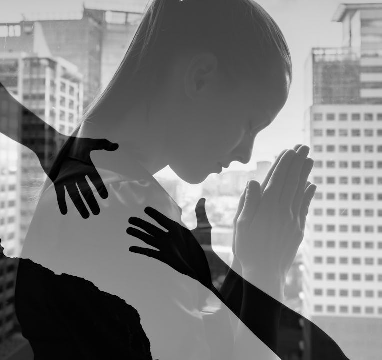 Young business woman praying to god asking for help.