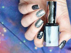 Manicure with a constellation map pattern on a cosmic background, good for astrology nail art ideas ...