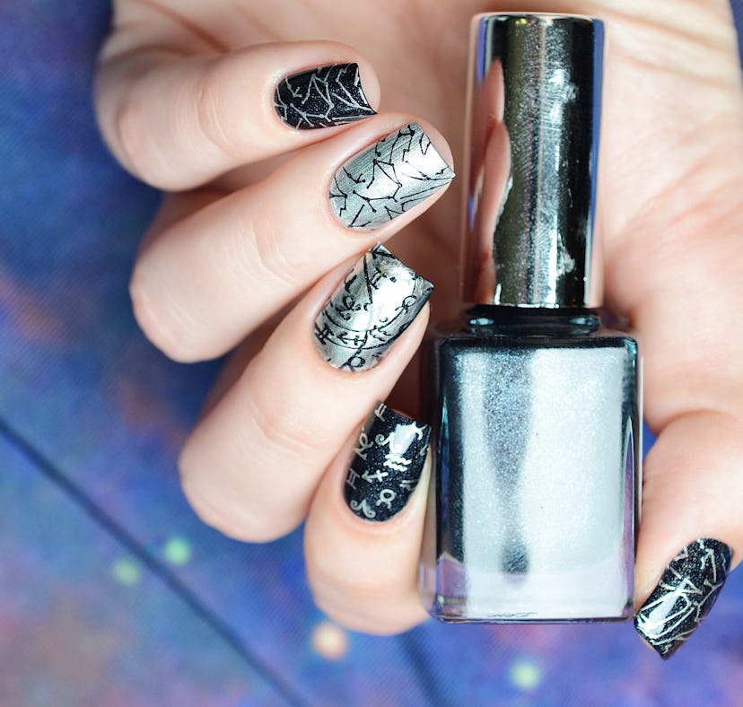 Manicure with a constellation map pattern on a cosmic background, good for astrology nail art ideas ...