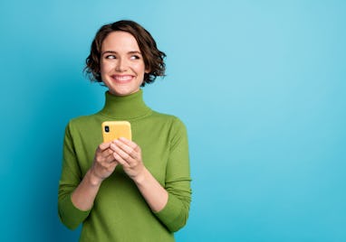 Portrait of positive cheerful girl use smart phone look copyspace share social media news wear style...