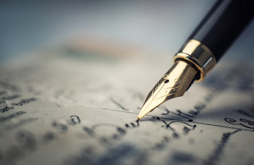 Old fountain pen on an vintage handwritten letter. Conceptual background on history, education, lite...