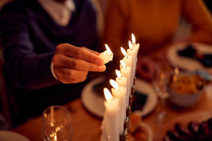 A family lightning the menorah during dinner on Hanukkah is something you'd need Hanukkah-themed gro...