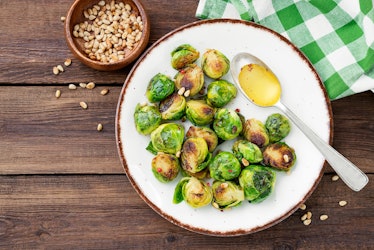 Homemade roasted brussel sprouts with pine nuts and butter sauce is a great winter solstice recipe.