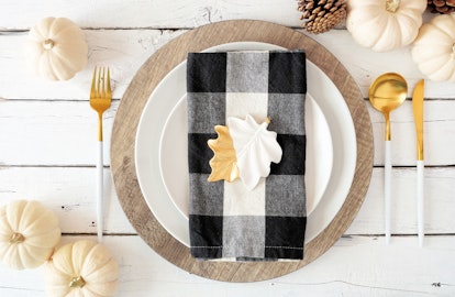 Take some inspiration from David Rose's wardrobe with a black-and-white table setting for Friendsgiv...