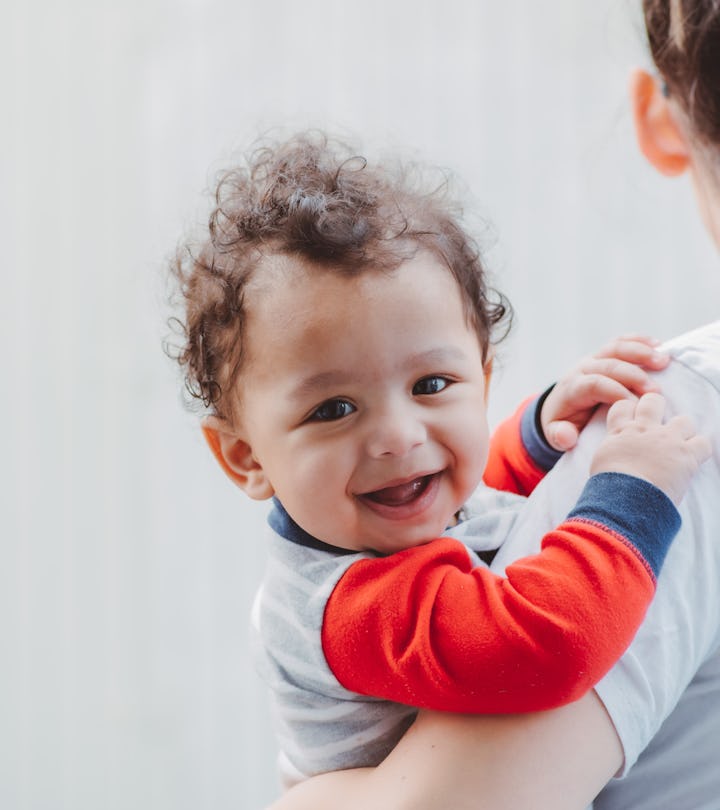 Mom holding baby in a story about Capricorn names