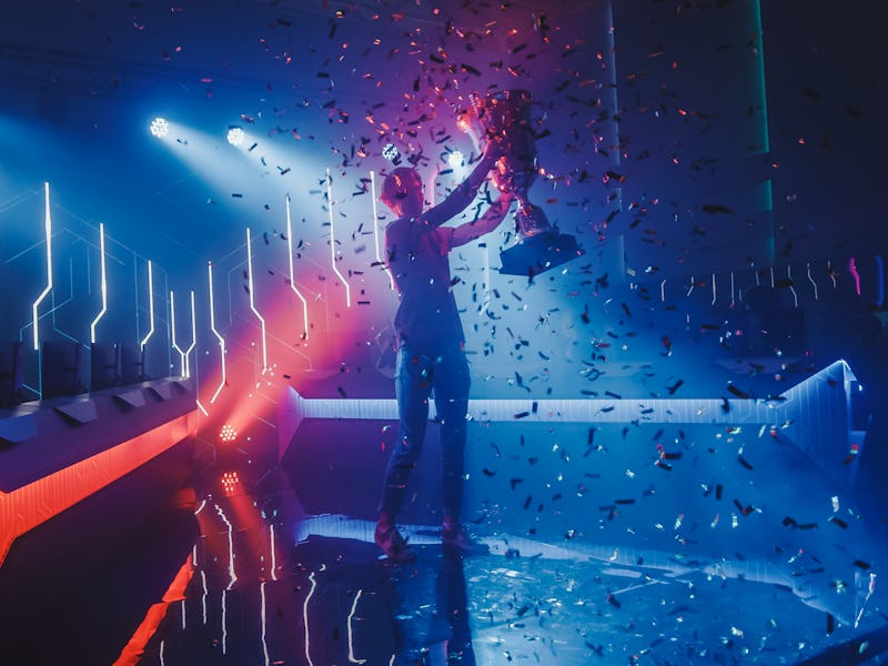 eSports Winner Trophy Standing on a Stage in the Middle of the Computer Video Games Championship Are...