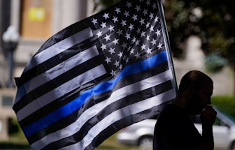 An unidentified man participates in a Blue Lives Matter rally in Kenosha, Wis. University of Wiscons...