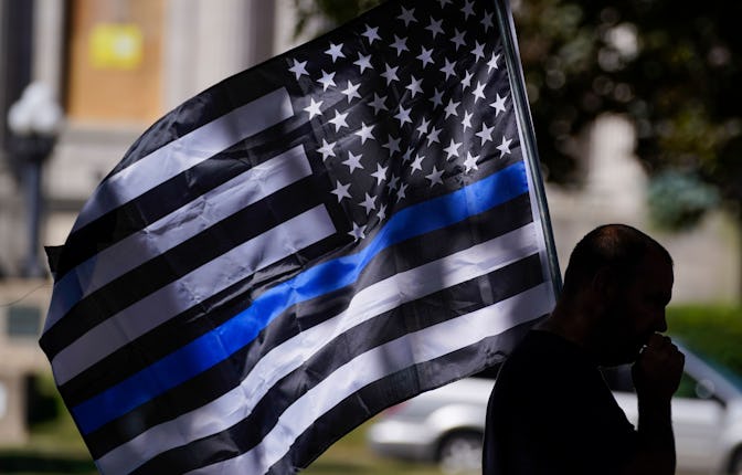 An unidentified man participates in a Blue Lives Matter rally in Kenosha, Wis. University of Wiscons...