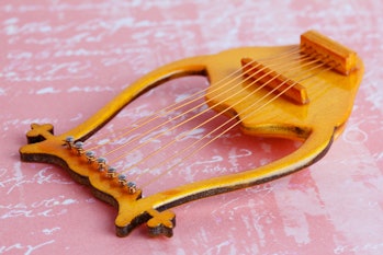 lyre - stringed plucked musical instrument . A symbol of poetry, poetic creativity, and poetic inspi...