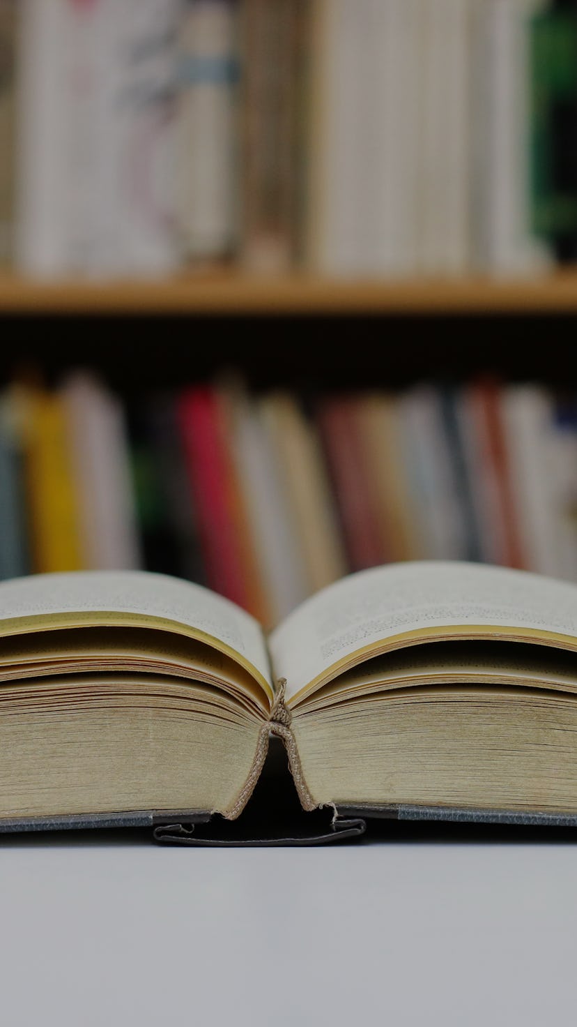 Open book on the table in library