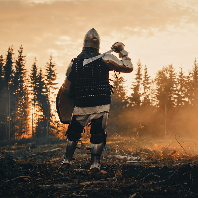 Medieval Knight Looking at Sunrise. Romantic Hero, Soldier, Warrior in Body Armour with Sword On a J...