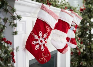 Empty Stockings Hung On Fireplace On Christmas Eve