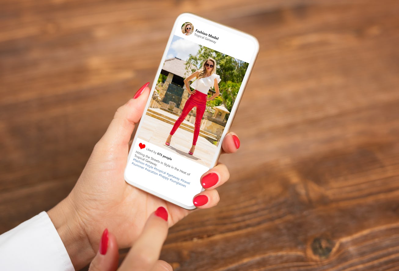 Photo of stylish and fashionable woman viewed on mobile phone