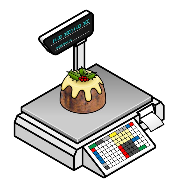Christmas holidays retail concept: buying a plum pudding on a POS scales.