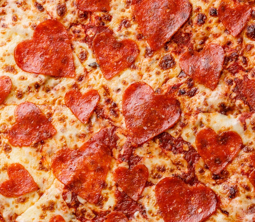 Heart shape Pepperoni Pizza close up background