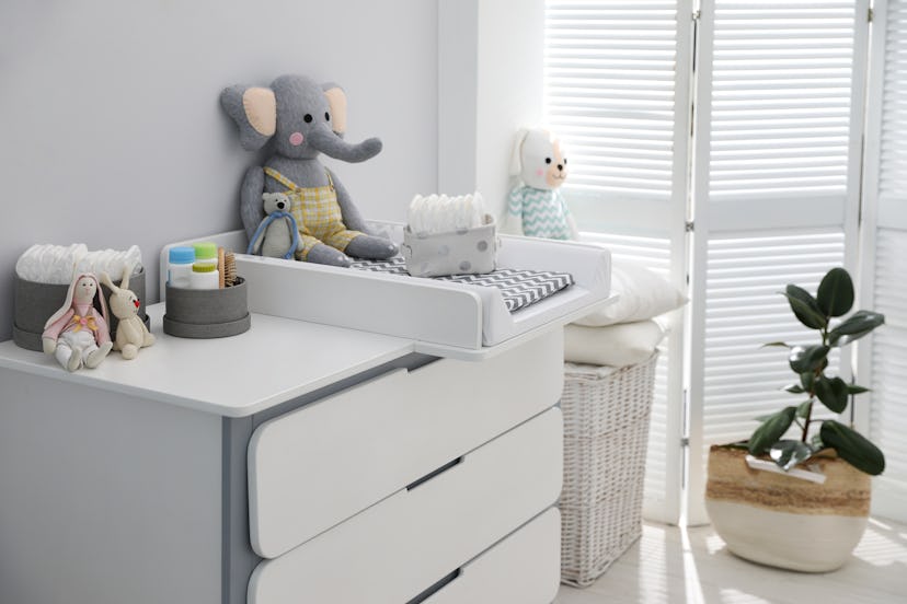 modern changing station in baby room nursery