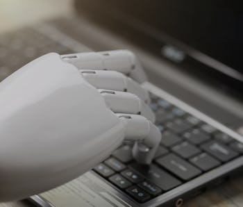 artificial intelligence hand type on keyboard
