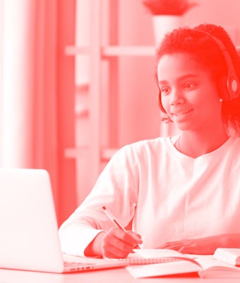 African teen girl wearing headphones study with internet chat skype teacher prepare for exam, black ...