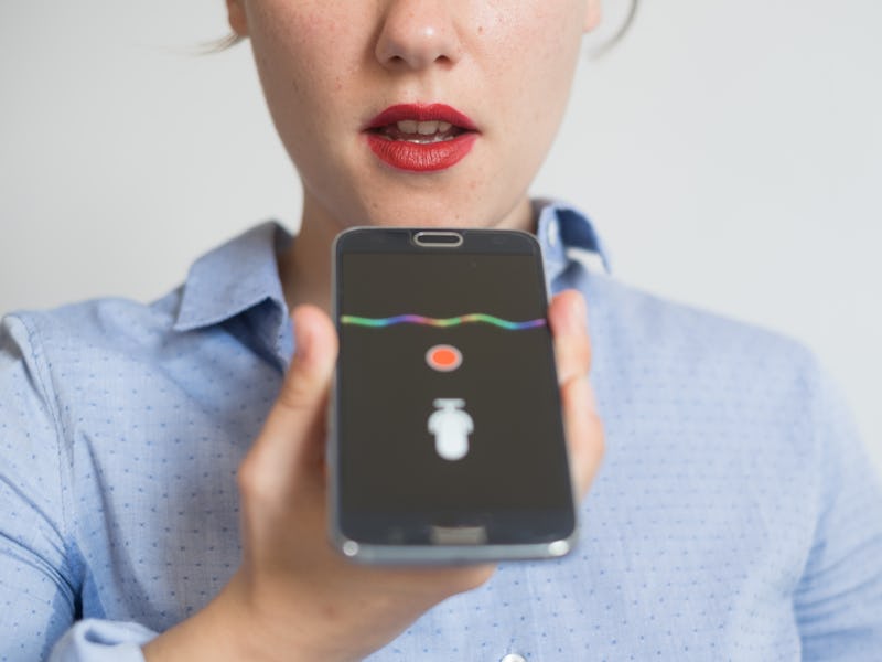 Woman talking on the phone with the digital voice assistant