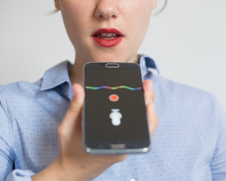 Woman talking on the phone with the digital voice assistant