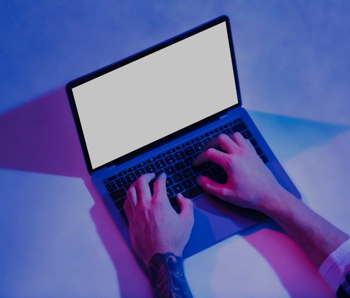 A pair of hands can be seen operating a laptop on a desk. The main colors are purple, blue, pink, an...