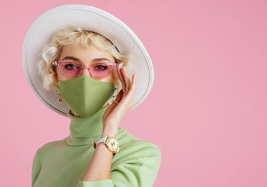 Woman wearing trendy fashion outfit during quarantine of coronavirus outbreak. Model dressed protect...