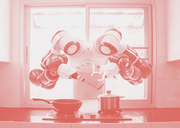 Chef robot Cooking In the kitchen of the future home genius. Intelligent robots work in modern homes...
