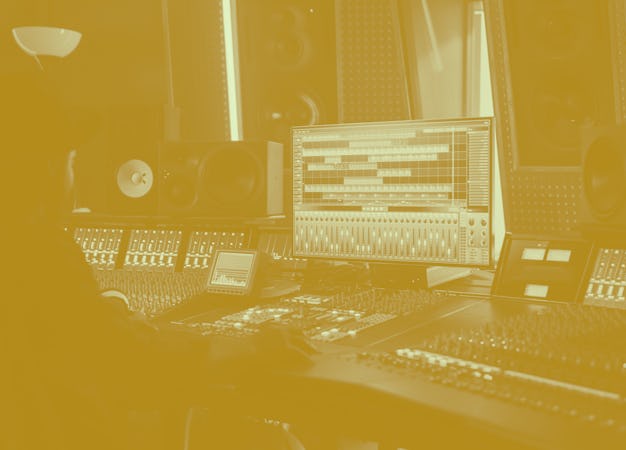 Portrait of Audio Engineer Working in Music Recording Studio, Uses Mixing Board Create Modern Sound....