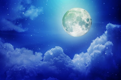 Full moon with night sky in the clouds ,Elements of this image furnished by NASA.