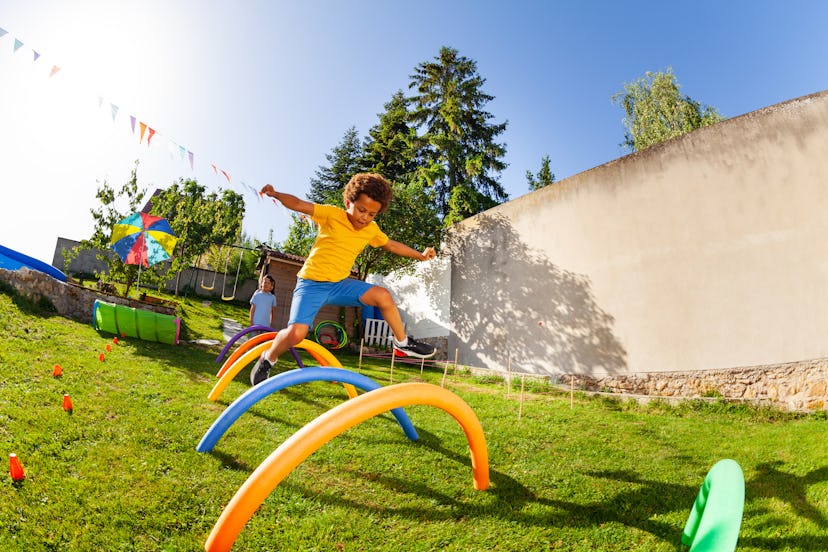 kid playing in an obstacle course