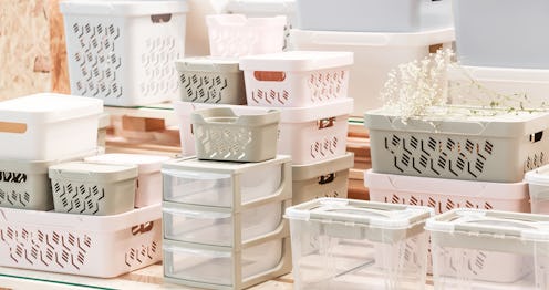 Organization of home space, storage and coziness, a lot of plastic household goods, new clean contai...