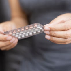 Woman holding combined oral contraceptive pill.Gynecology concept.
