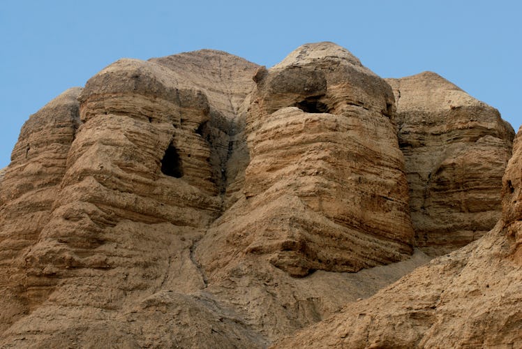 Qumran caves in Qumran National Park near the Dead Sea Israel where the Dead Sea Scrolls discovered ...
