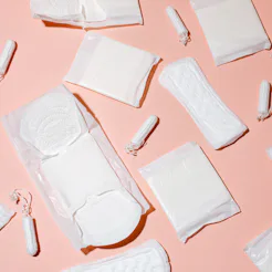Tampons, feminine sanitary pads pattern on pink background. Hygiene care during critical days. Menst...