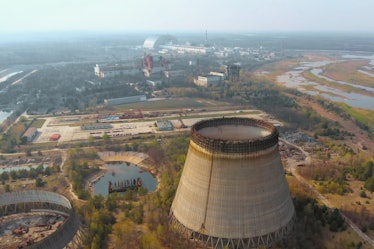 Chernobyl nuclear power plant. Cooling tower overlooking the nuclear power plant in Chernobyl. View ...