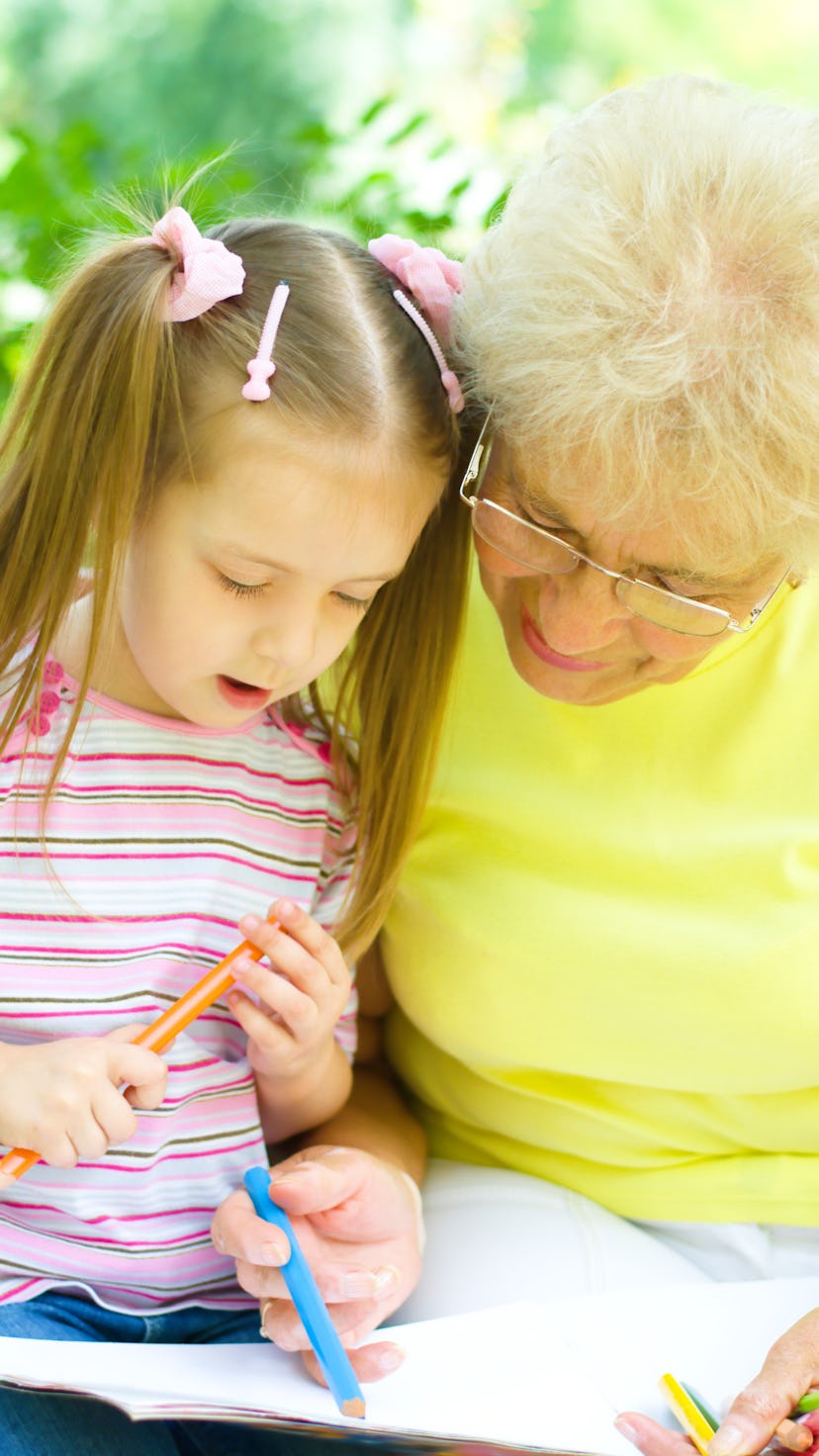 little girl with her grandmother drawing