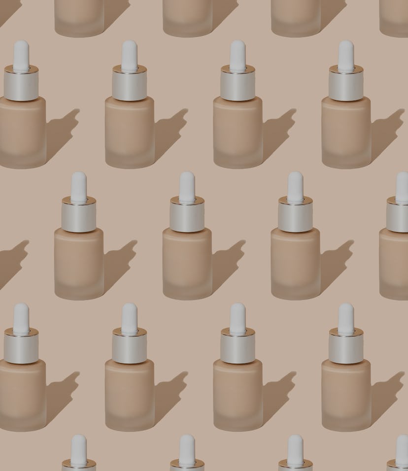 Bright pattern in pastel colors from cosmetic makeup products. A jar of foundation on a beige backgr...